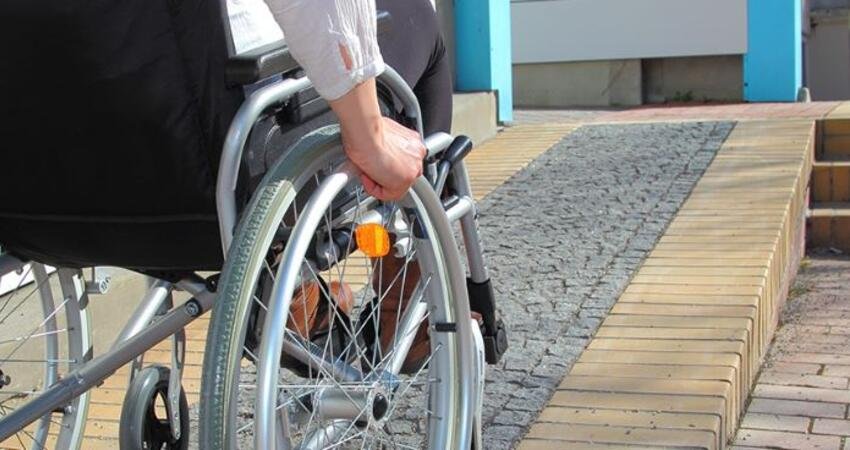 Aging-in-place grab bar installation in bathroom with chrome finish