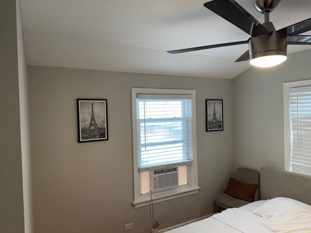 Modern ceiling fan installation with LED light kit in bedroom