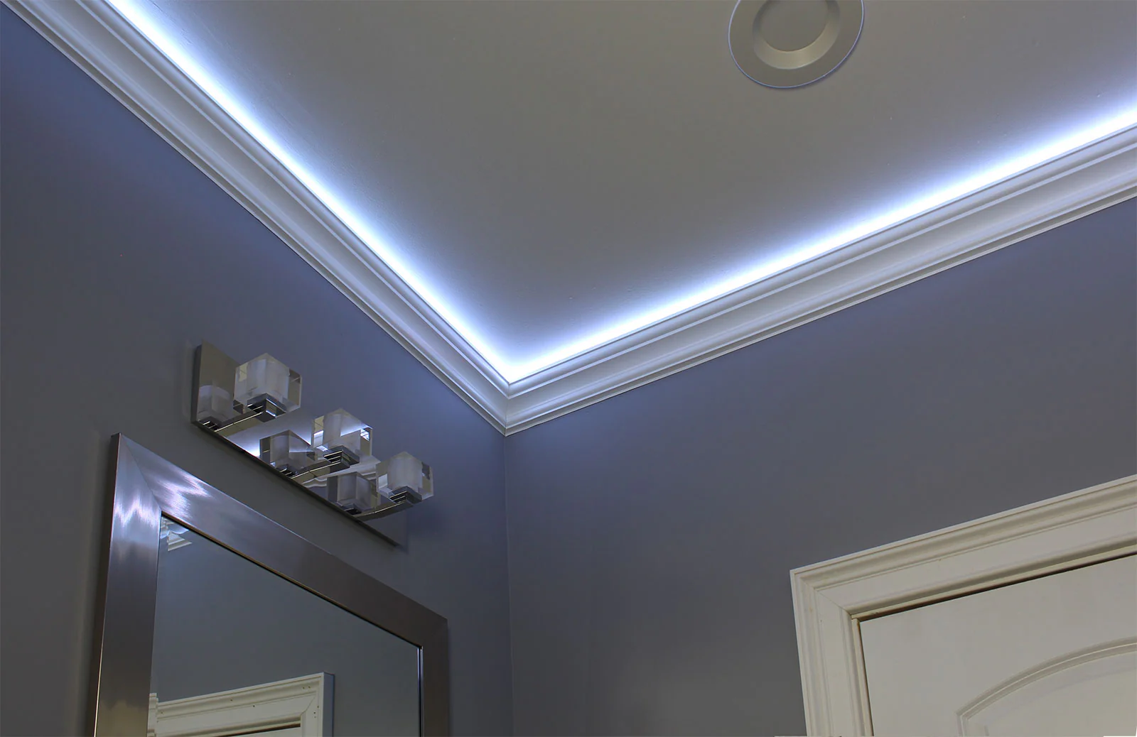 Crown molding installation at ceiling junction with precise miter joints