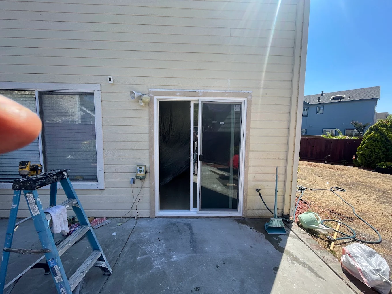 Sliding glass patio door installation with energy-efficient Low-E glass
